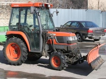 Kubota ST30 with brush and blade - Traktors