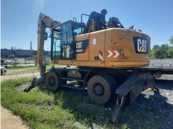 Riteņu ekskavators CATERPILLAR MH3024