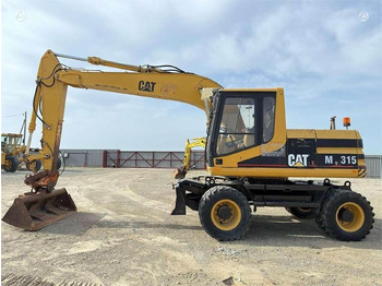 Riteņu ekskavators CATERPILLAR M315