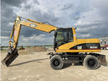 Riteņu ekskavators CAT M315C: foto 4