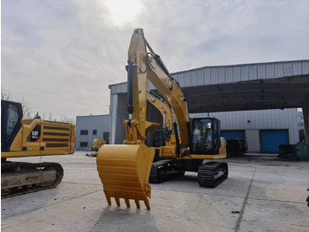 Kāpurķēžu ekskavators CATERPILLAR 323