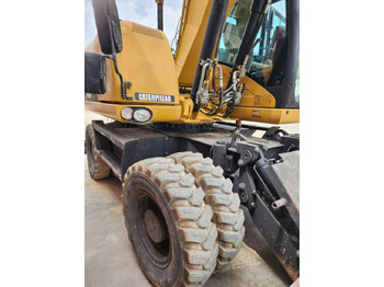 Riteņu ekskavators CAT M313D: foto 4