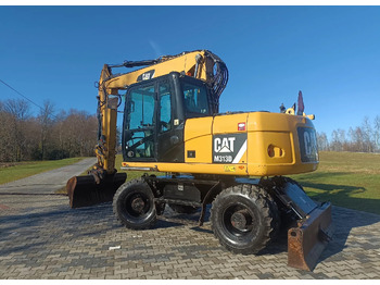 Riteņu ekskavators CATERPILLAR M313D