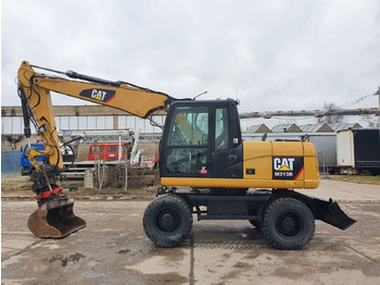 Riteņu ekskavators CATERPILLAR M313D