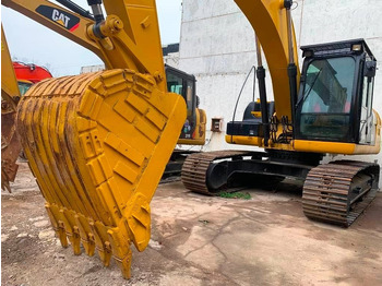 Kāpurķēžu ekskavators CATERPILLAR 323DL