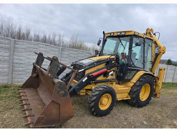 Ekskavators-iekrāvējs CATERPILLAR