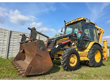 Ekskavators-iekrāvējs CATERPILLAR