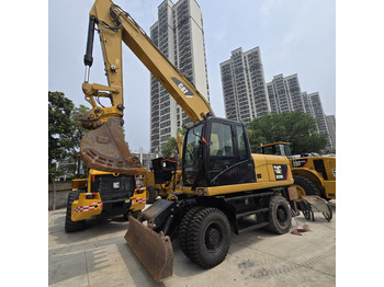 Riteņu ekskavators CATERPILLAR M320