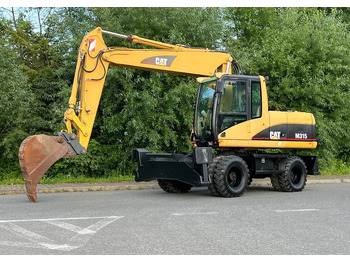 Riteņu ekskavators CATERPILLAR M315C