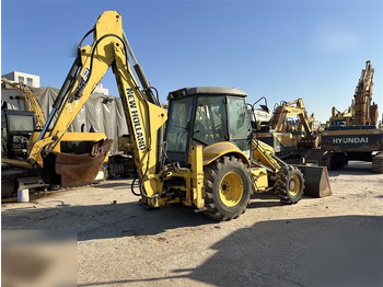 Ekskavators-iekrāvējs NEW HOLLAND