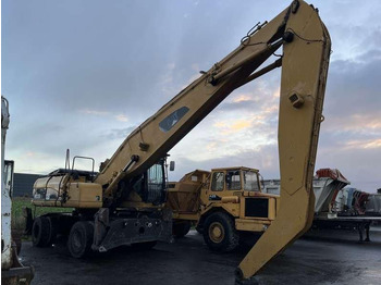 Atkritumu iekrāvējs CATERPILLAR