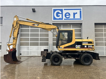 Riteņu ekskavators CATERPILLAR M315
