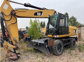 Riteņu ekskavators CATERPILLAR M322D