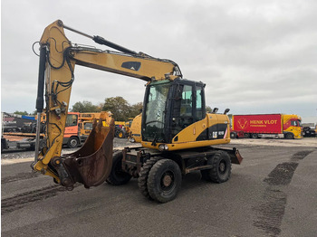 Riteņu ekskavators CATERPILLAR M313D