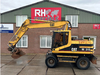 Riteņu ekskavators CATERPILLAR M315