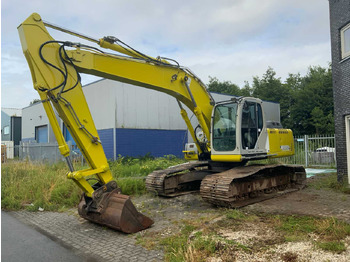 Kāpurķēžu ekskavators NEW HOLLAND E215B