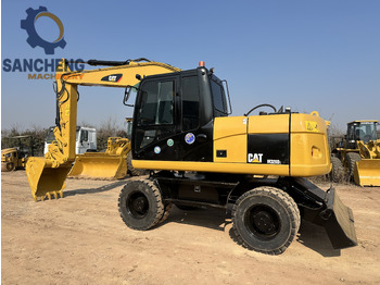 Riteņu ekskavators CATERPILLAR M320