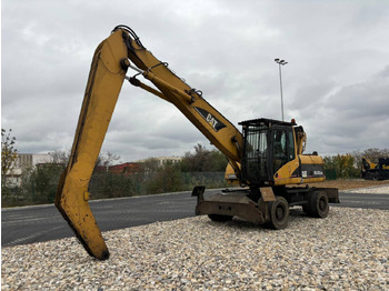 Riteņu ekskavators CATERPILLAR M318