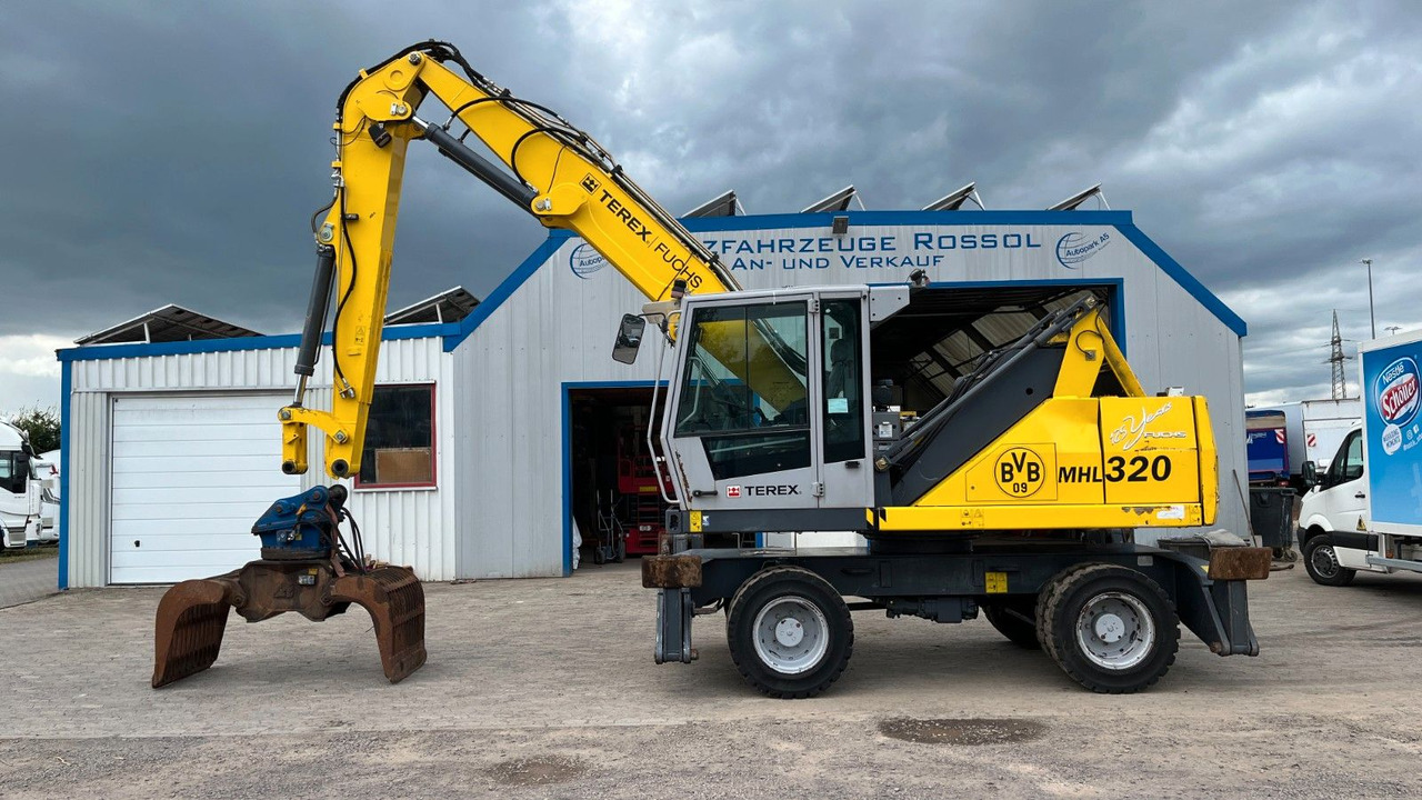Fuchs TeRex MHL 320 D Umschlagbagger Greifer Pratzen - Atkritumu iekrāvējs: foto 1 Fuchs TeRex MHL 320 D Umschlagbagger Greifer Pratzen - Atkritumu iekrāvējs: foto 1