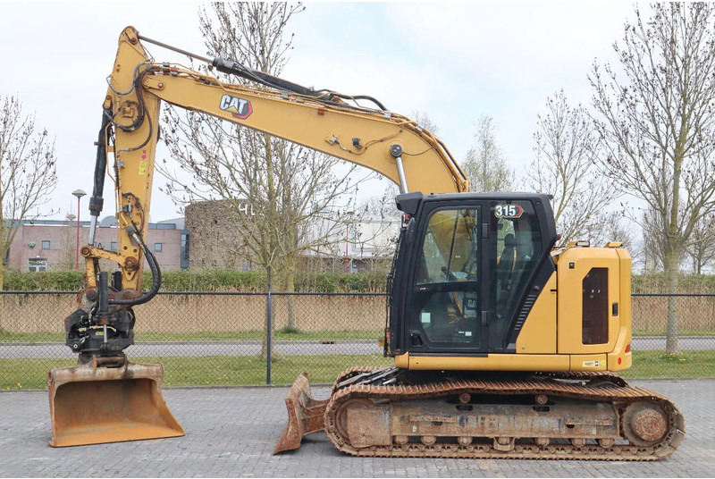 Caterpillar 315 07B | ROTOTILT | BUCKET | DOZERBLADE - Kāpurķēžu ekskavators: foto 1 Caterpillar 315 07B | ROTOTILT | BUCKET | DOZERBLADE - Kāpurķēžu ekskavators: foto 1