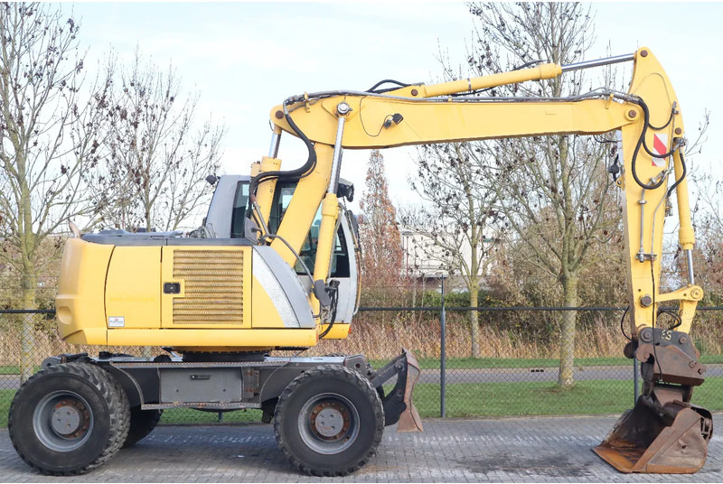 New Holland MH CITY | TILT BUCKET | QUICK COUPLER | DOZER BLADE - Riteņu ekskavators: foto 4 New Holland MH CITY | TILT BUCKET | QUICK COUPLER | DOZER BLADE - Riteņu ekskavators: foto 4