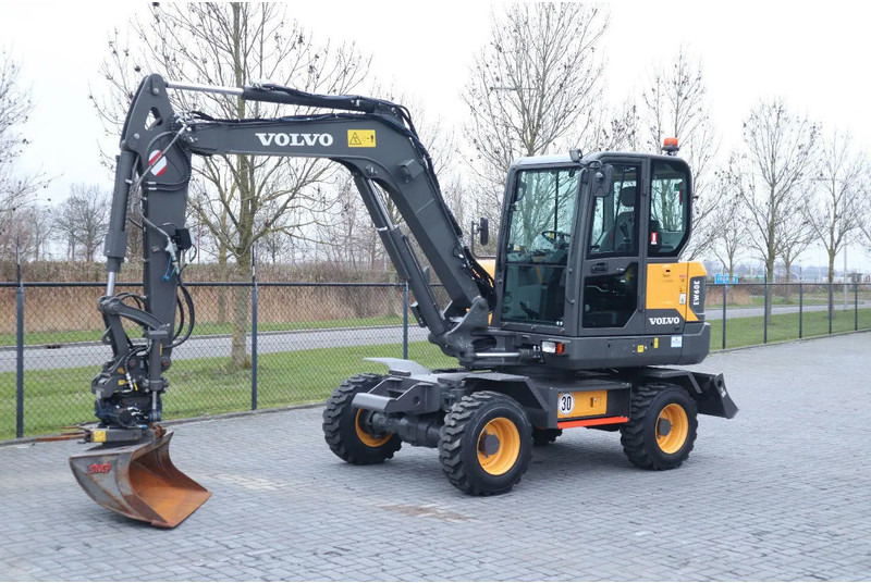 Volvo EW60E | DEMO | 30 KM/H | ROTOTILT + GRIPPER | BUCKET - Riteņu ekskavators: foto 2 Volvo EW60E | DEMO | 30 KM/H | ROTOTILT + GRIPPER | BUCKET - Riteņu ekskavators: foto 2