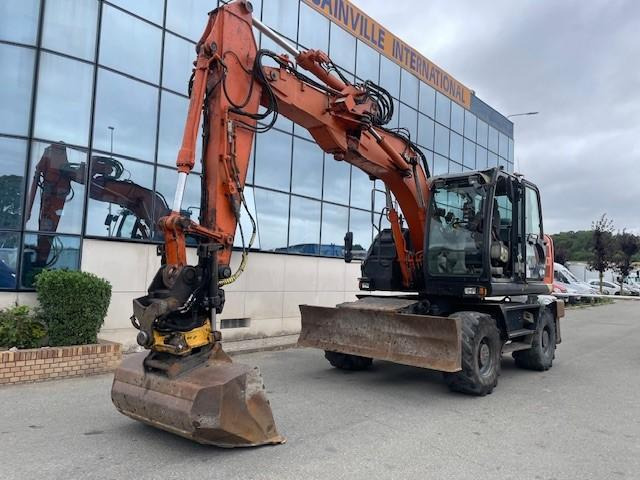 Hitachi ZX140W-5B - Riteņu ekskavators: foto 1 Hitachi ZX140W-5B - Riteņu ekskavators: foto 1