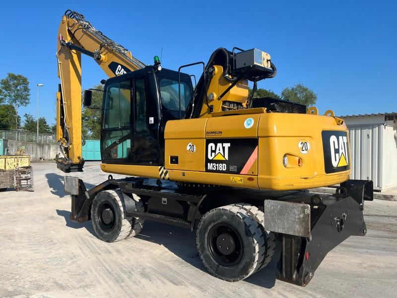 Caterpillar M318D MH - Atkritumu iekrāvējs: foto 1 Caterpillar M318D MH - Atkritumu iekrāvējs: foto 1