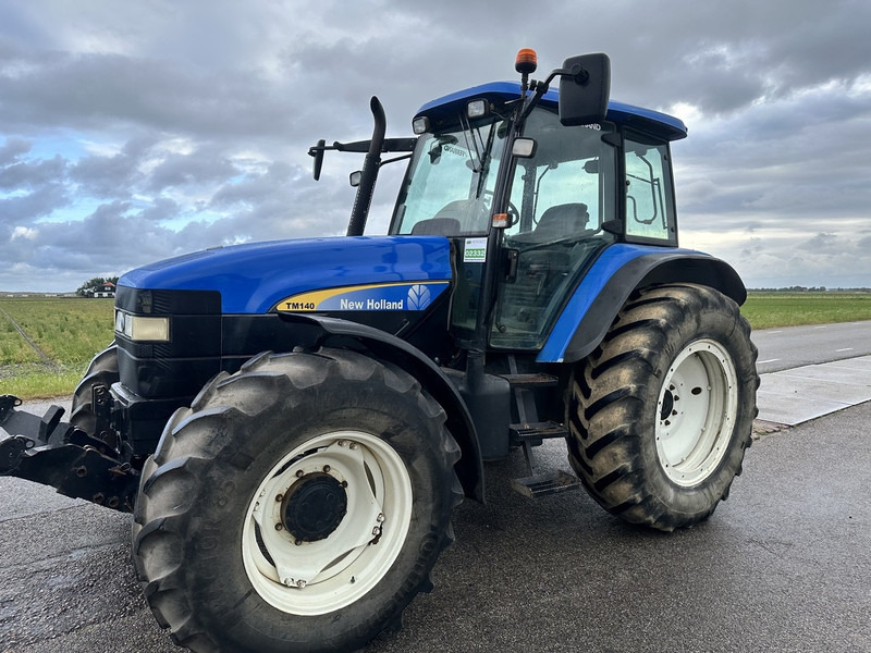 New Holland TM 140 - Traktors: foto 1 New Holland TM 140 - Traktors: foto 1