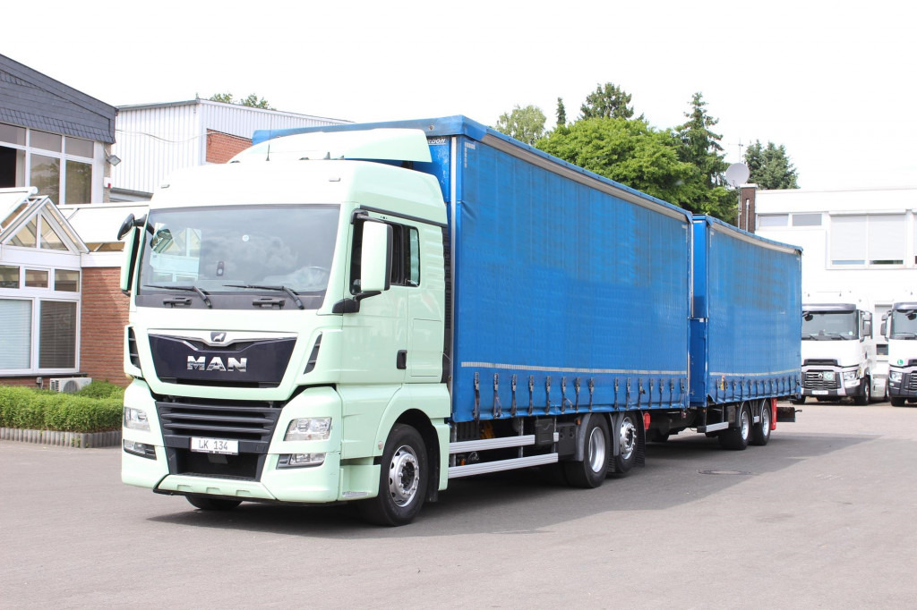 MAN TGX26.460 Durchlad Plane-Jumbo Retarder Hubdach - Kravas automašīna ar tentu: foto 1 MAN TGX26.460 Durchlad Plane-Jumbo Retarder Hubdach - Kravas automašīna ar tentu: foto 1