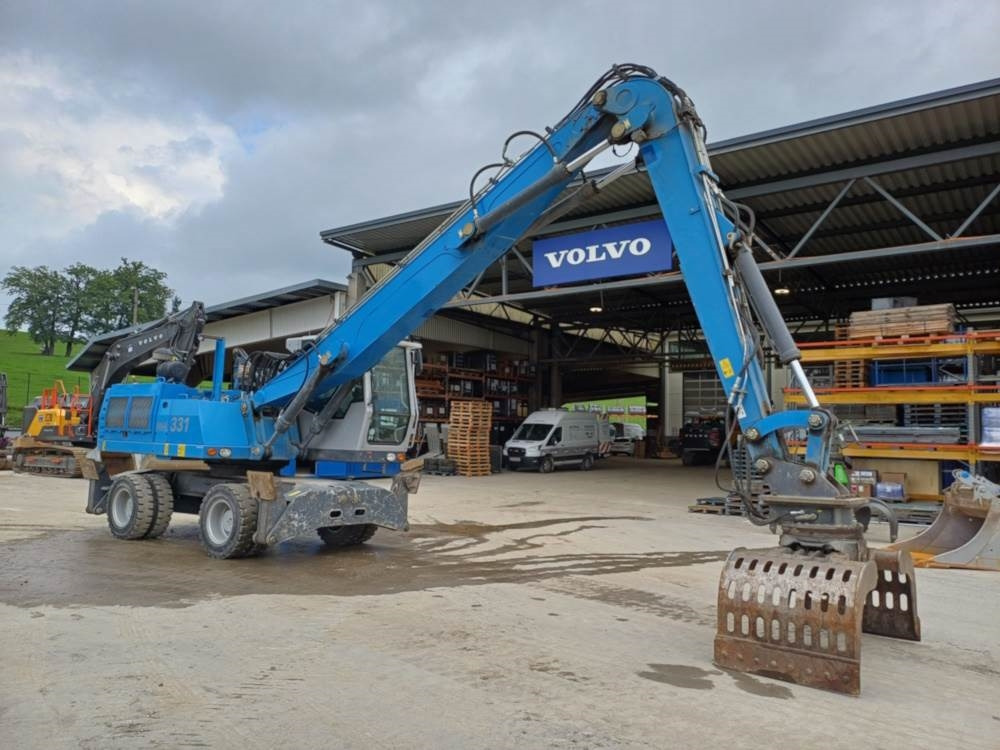 Fuchs MHL 331 - Atkritumu iekrāvējs: foto 1 Fuchs MHL 331 - Atkritumu iekrāvējs: foto 1