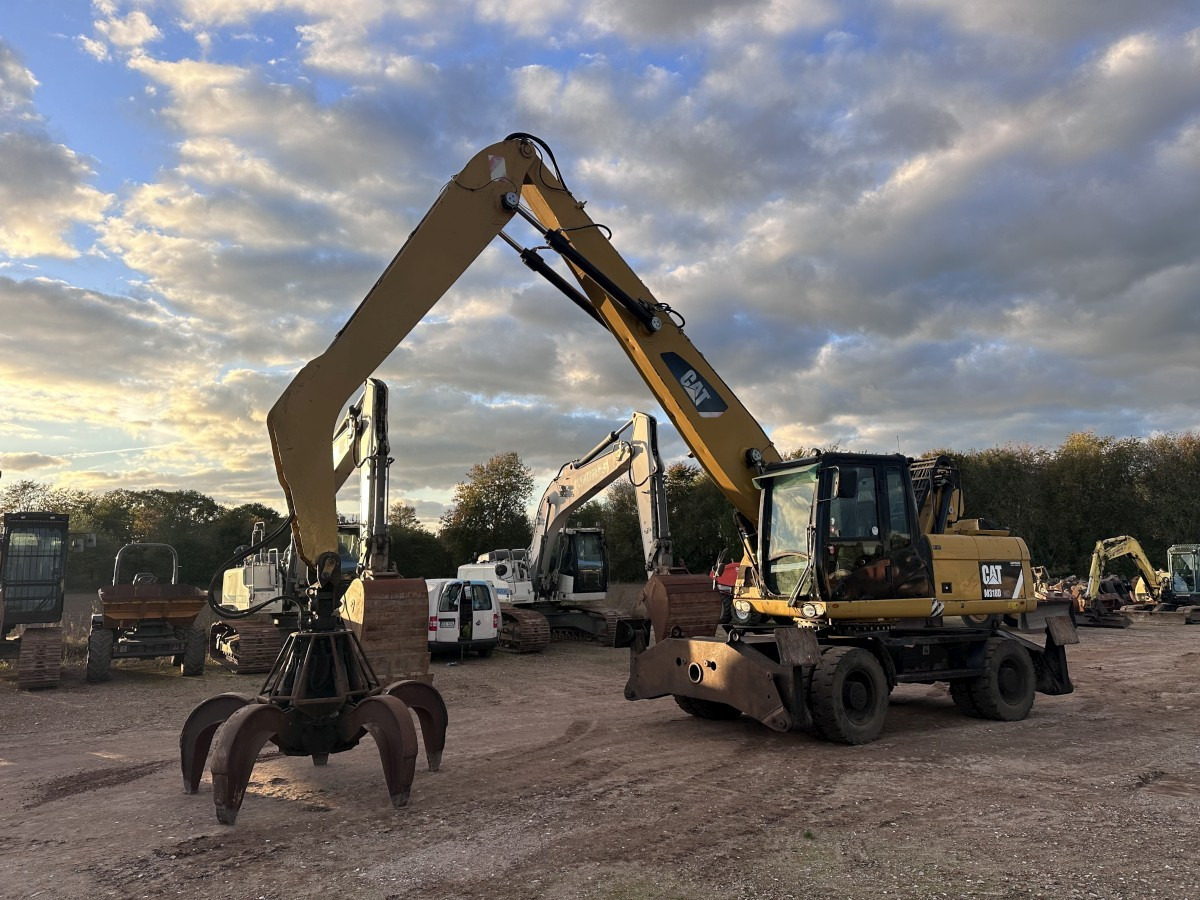 CATERPILLAR M 318 MH mit Greifer Kein 3022 3026 320 322 - Riteņu ekskavators: foto 1 CATERPILLAR M 318 MH mit Greifer Kein 3022 3026 320 322 - Riteņu ekskavators: foto 1