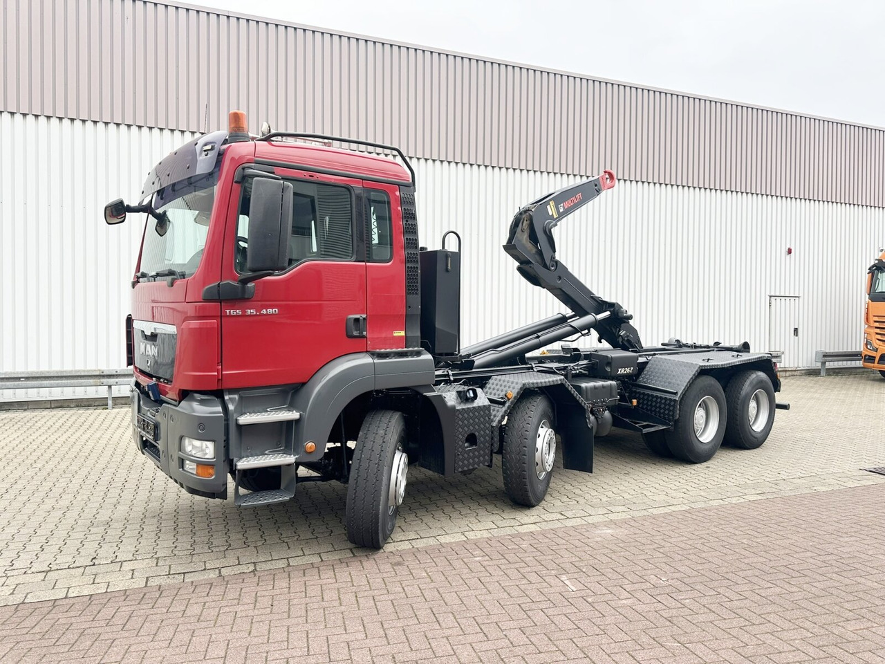 MAN TGS 35.480 8X4 BL TGS 35.400 8x4 BL, Schub-Knick bis 6,5m Container - Pacēlājs ar āķi: foto 1 MAN TGS 35.480 8X4 BL TGS 35.400 8x4 BL, Schub-Knick bis 6,5m Container - Pacēlājs ar āķi: foto 1