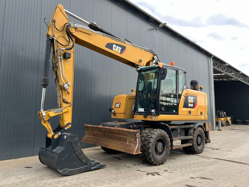 Cat M318F - Riteņu ekskavators: foto 1 Cat M318F - Riteņu ekskavators: foto 1