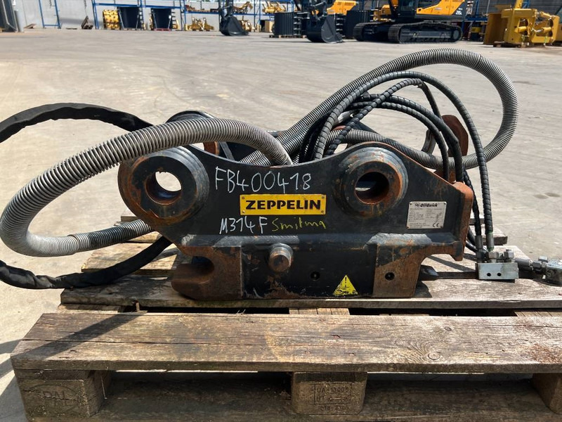 OilQuick OQ65 - M314F / M316F / M318F - Ātrā sakabe - Celtniecības tehnika: foto 4 OilQuick OQ65 - M314F / M316F / M318F - Ātrā sakabe - Celtniecības tehnika: foto 4