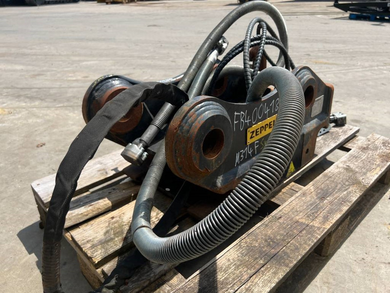 OilQuick OQ65 - M314F / M316F / M318F - Ātrā sakabe - Celtniecības tehnika: foto 5 OilQuick OQ65 - M314F / M316F / M318F - Ātrā sakabe - Celtniecības tehnika: foto 5