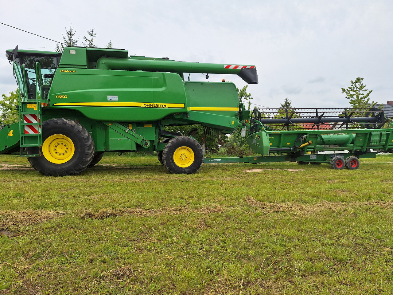 John Deere T550 - Labības kombains: foto 1 John Deere T550 - Labības kombains: foto 1