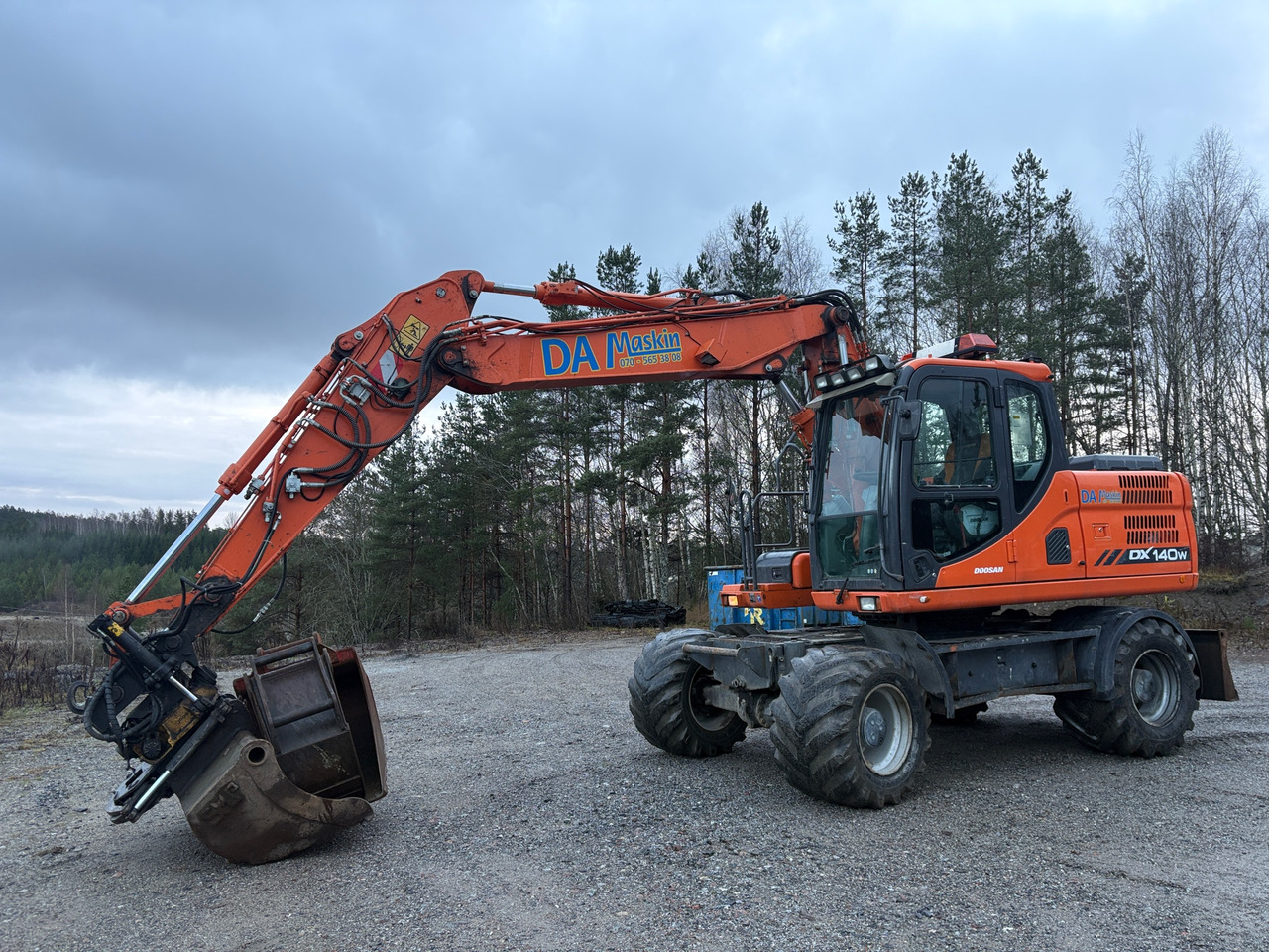 Doosan DX140W - Ekskavators: foto 1 Doosan DX140W - Ekskavators: foto 1