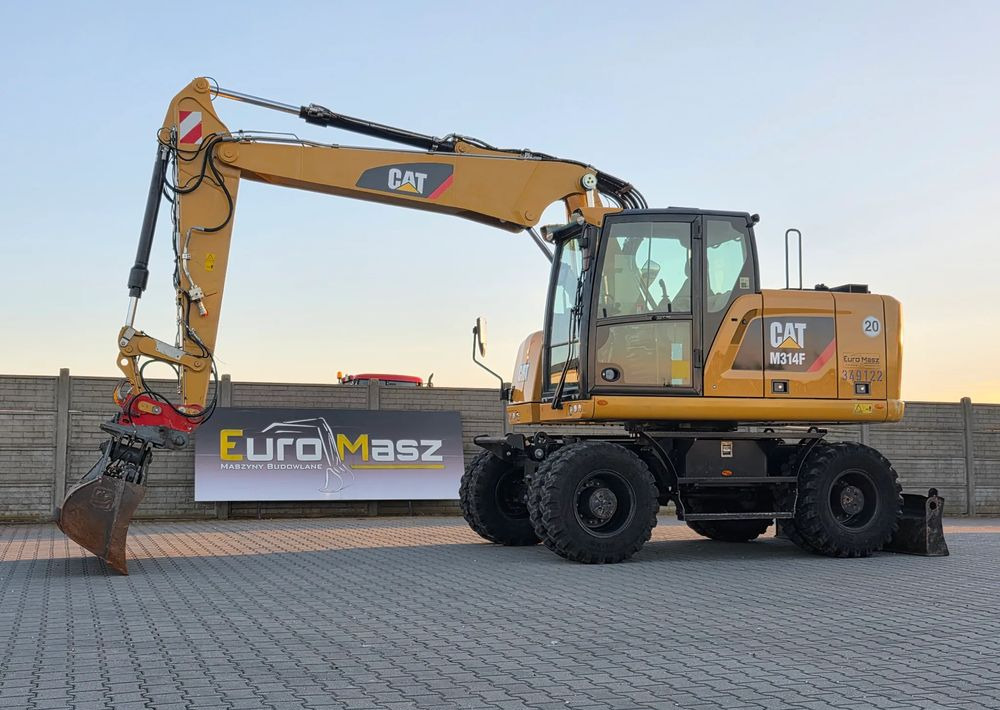 Caterpillar M314F, 2018 ROK, 4200 MTH, 2 ŁYŻKI - Riteņu ekskavators: foto 1 Caterpillar M314F, 2018 ROK, 4200 MTH, 2 ŁYŻKI - Riteņu ekskavators: foto 1