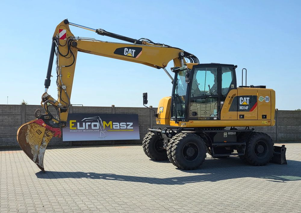 Caterpillar M314F, 2019 ROK, 3300 MTH, OIL QUICK OQ 65 - Riteņu ekskavators: foto 1 Caterpillar M314F, 2019 ROK, 3300 MTH, OIL QUICK OQ 65 - Riteņu ekskavators: foto 1