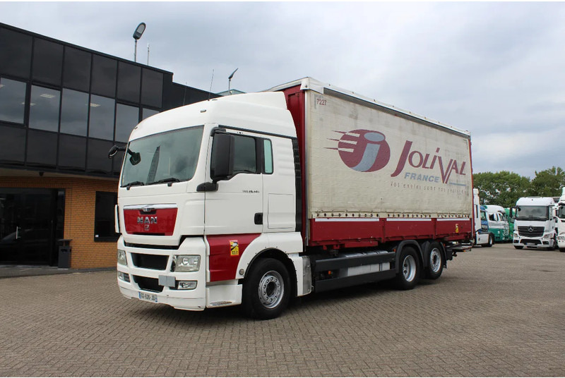 MAN TGX 26.440 * EURO5 * 6X2 * LIFT AXLE * - Kravas automašīna ar tentu: foto 1 MAN TGX 26.440 * EURO5 * 6X2 * LIFT AXLE * - Kravas automašīna ar tentu: foto 1