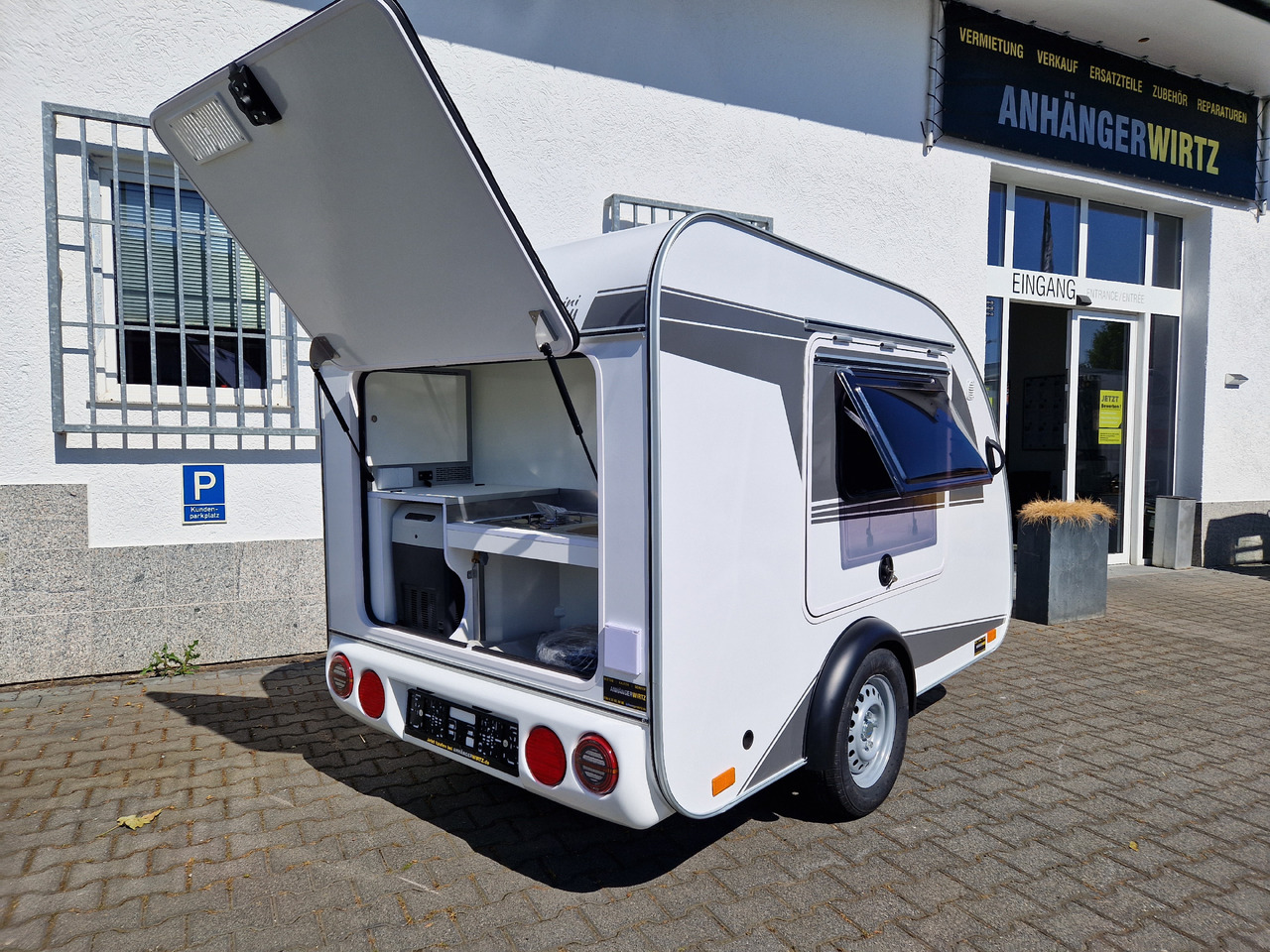 Dzīvojamais treileris Mini Camper Mini Tommy TMC25 252x140x121cm aero V1 Küche 12V/230V 100km/H 750kg gebremst Modell 24: foto 16