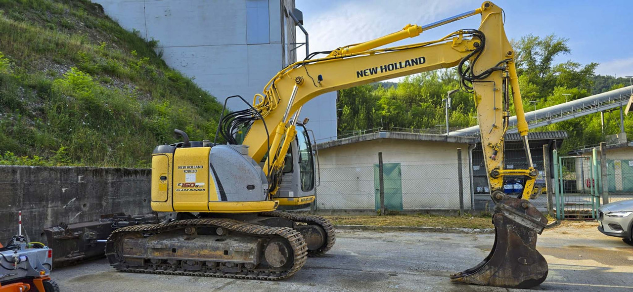 New Holland Kobelco E150B - Kāpurķēžu ekskavators: foto 2 New Holland Kobelco E150B - Kāpurķēžu ekskavators: foto 2