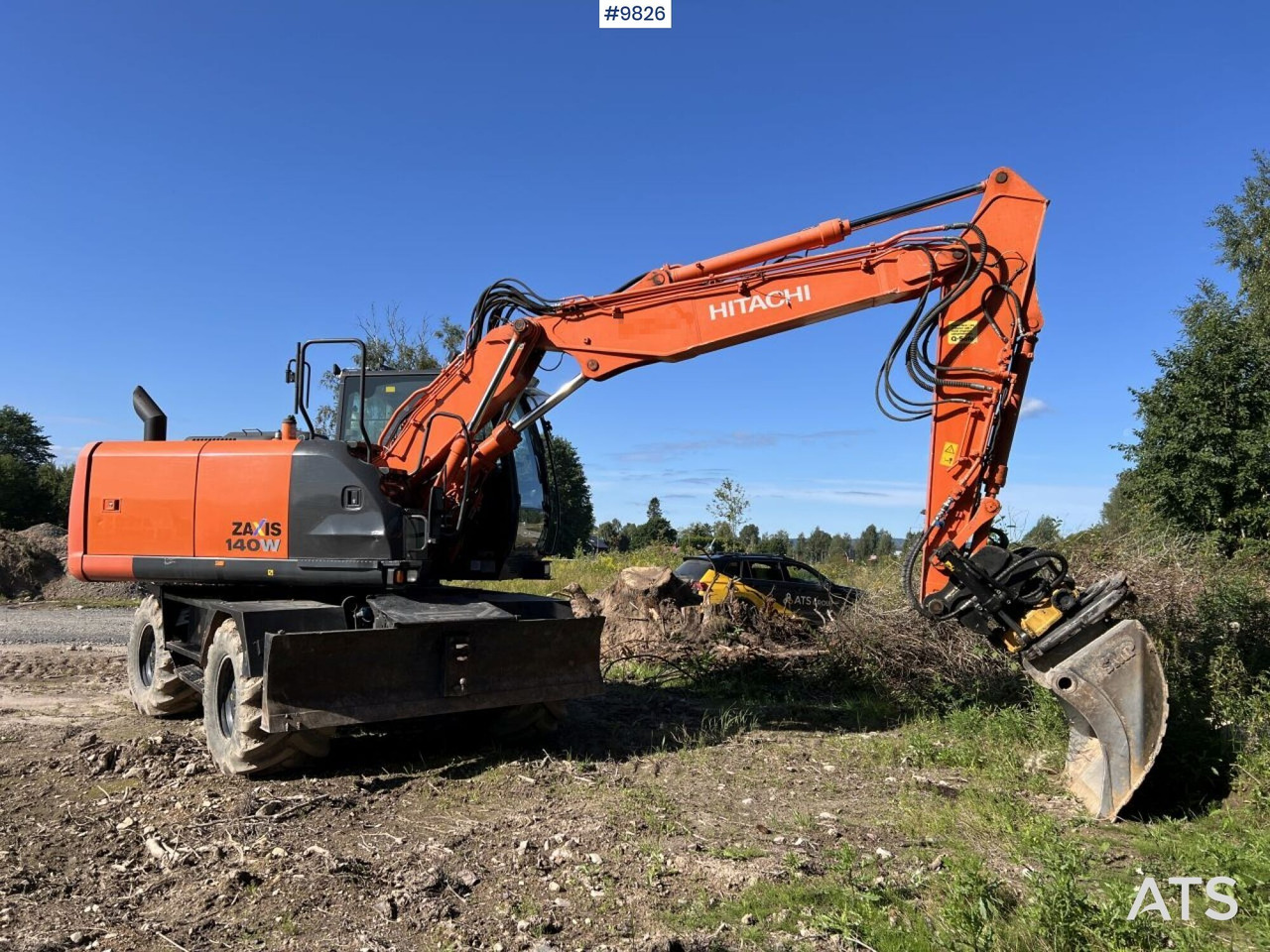 Hitachi ZX140 W-5B with rotor and planer bucket - Riteņu ekskavators: foto 1 Hitachi ZX140 W-5B with rotor and planer bucket - Riteņu ekskavators: foto 1