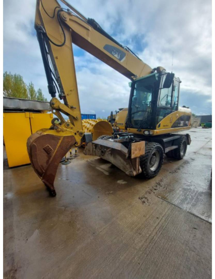 CAT M315D - Riteņu ekskavators: foto 1 CAT M315D - Riteņu ekskavators: foto 1