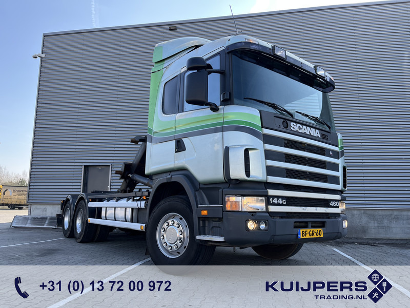 Scania R 144G V8 460 6x2 Boogie / 874 dkm / Blad - Blad / Hook Lift / NL Truck - Pacēlājs ar āķi: foto 1 Scania R 144G V8 460 6x2 Boogie / 874 dkm / Blad - Blad / Hook Lift / NL Truck - Pacēlājs ar āķi: foto 1