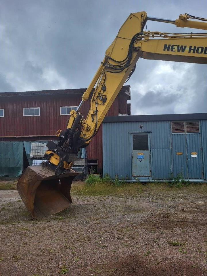 New Holland Kobelco E 235 B SR-2 - Kāpurķēžu ekskavators: foto 4 New Holland Kobelco E 235 B SR-2 - Kāpurķēžu ekskavators: foto 4