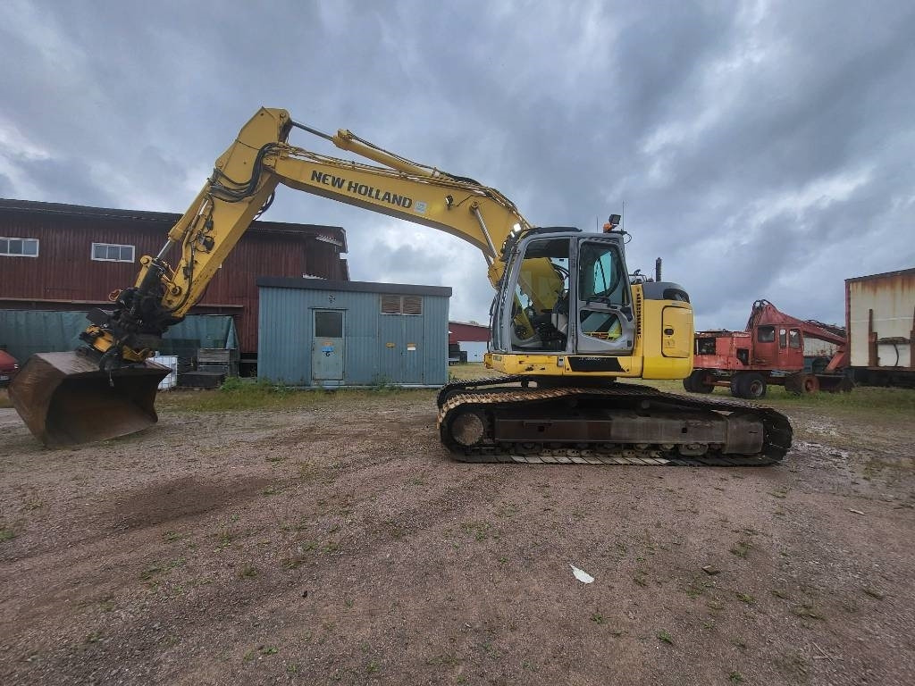 New Holland Kobelco E 235 B SR-2 - Kāpurķēžu ekskavators: foto 2 New Holland Kobelco E 235 B SR-2 - Kāpurķēžu ekskavators: foto 2