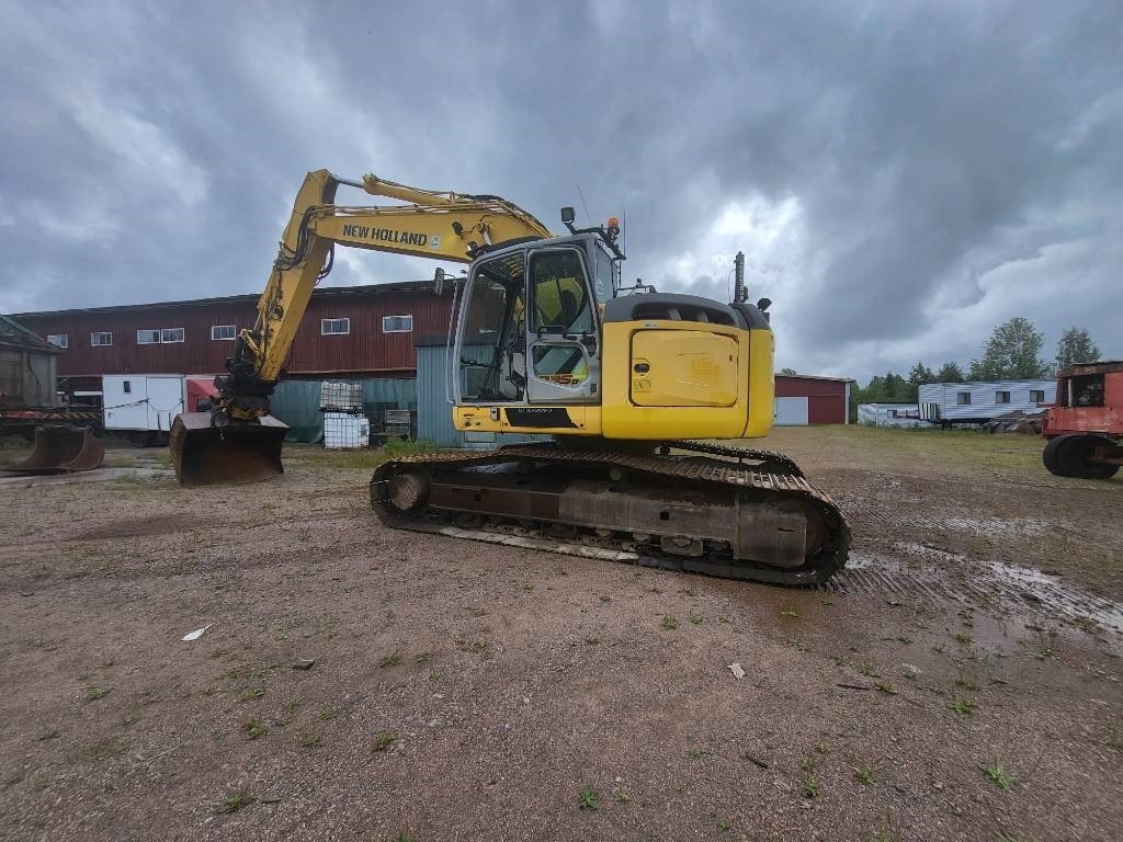 New Holland Kobelco E 235 B SR-2 - Kāpurķēžu ekskavators: foto 3 New Holland Kobelco E 235 B SR-2 - Kāpurķēžu ekskavators: foto 3