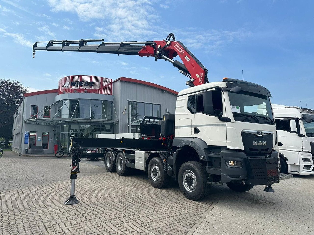 MAN TGS 41.520 8x8 mit Fassi Ladekran F710RA.2.26 - Kravas auto ar manipulatoru: foto 1 MAN TGS 41.520 8x8 mit Fassi Ladekran F710RA.2.26 - Kravas auto ar manipulatoru: foto 1